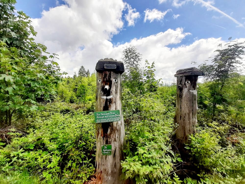Wooden trail figures carved from tree stumps along the hiking trail to Mount Pröller near Sankt Englmar in the Bavarian Forest