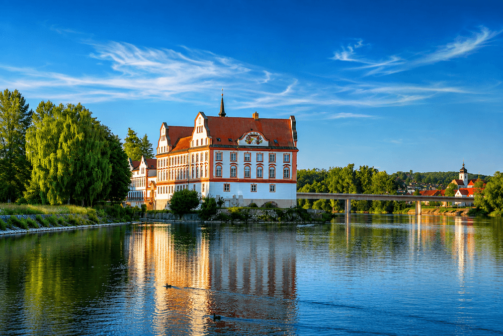 neuburg-castle-river-inn Neuburg Castle reflected in the River Inn near Passau, Bavaria, close to the Austrian border